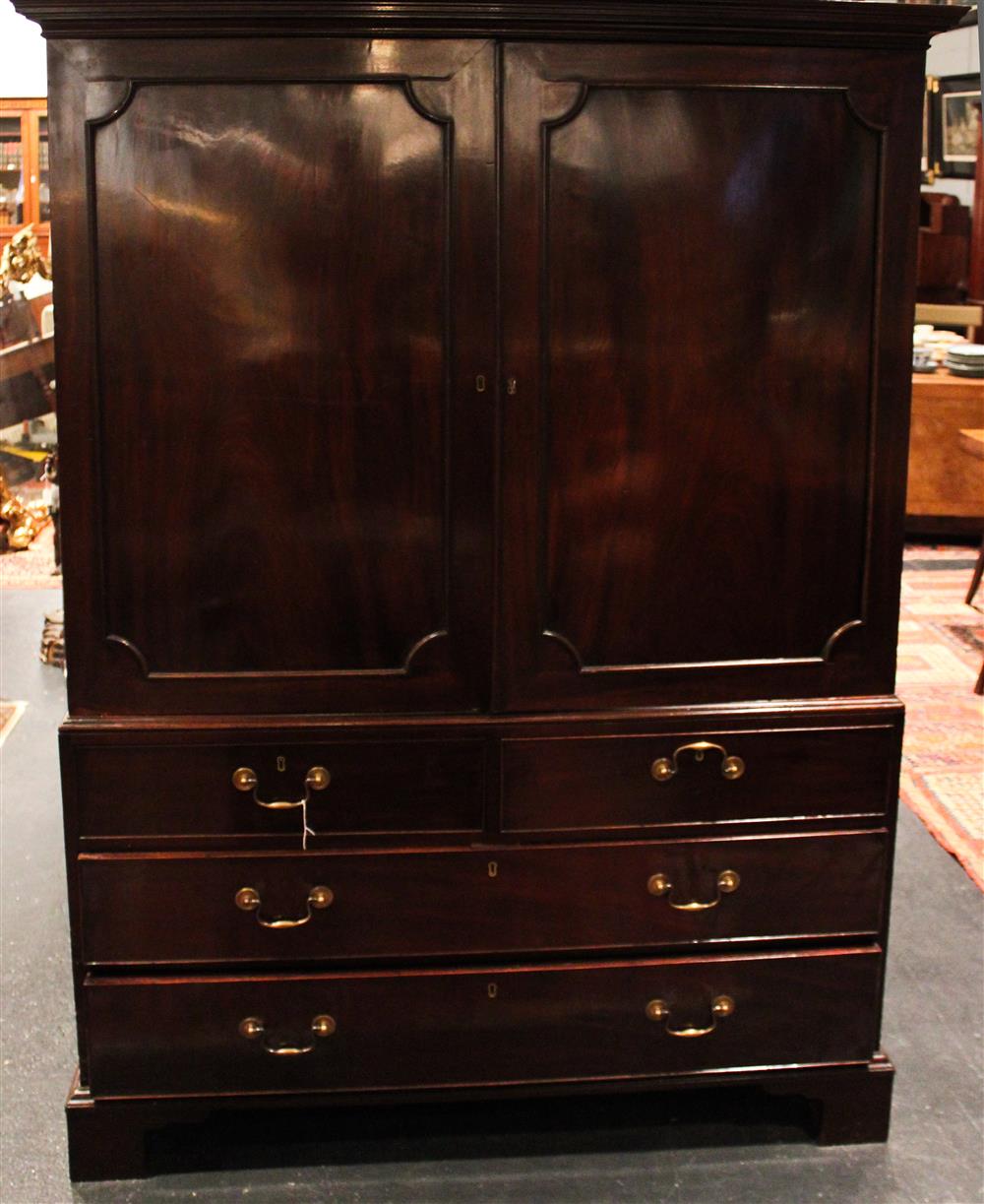 Appraisal: GEORGIAN MAHOGANY LINEN PRESS having an upper section with molded