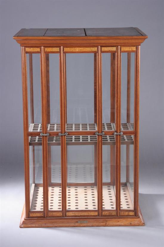 Appraisal: AMERICAN CANE DISPLAY CASE early th century Glass-enclosed segmented case