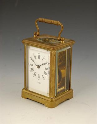 Appraisal: A French gilt brass corniche case carriage timepiece with a