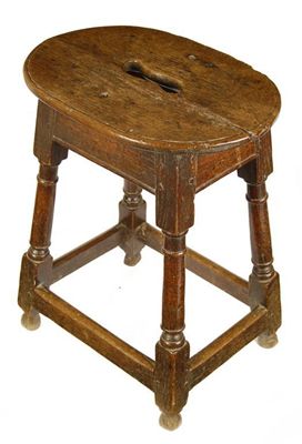 Appraisal: An oak joined stool with an oval top having a