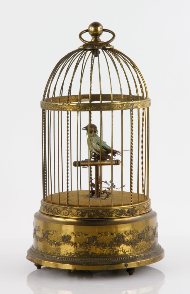 Appraisal: - Automaton Feathered Bird Automaton feathered singing bird in an