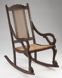 Appraisal: West Indies style mahogany cane rocking chair h West Indies