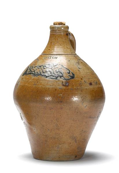 Appraisal: A stoneware jug with cobalt fish decoration attributed to Jonathan