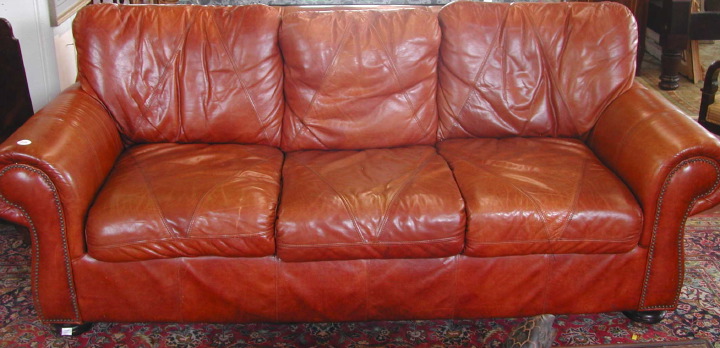 Appraisal: Contemporary Leather Sofa of traditional form with loose pieced-leather cushions