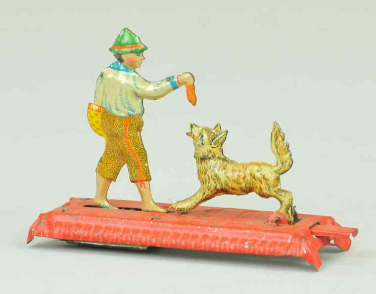 Appraisal: MAN FEEDING DOG PENNY TOY Germany when lever is pushed