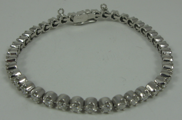 Appraisal: DIAMOND AND FOURTEEN KARAT WHITE GOLD BRACELET in length and