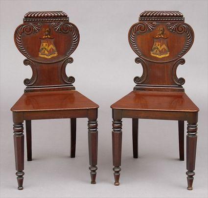 Appraisal: PAIR OF WILILAM IV MAHOGANY HALL CHAIRS WITH PAINTED ARMORIALS