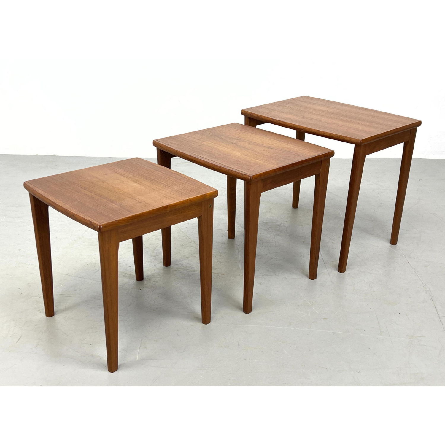 Appraisal: pc Danish Modern Teak Nesting Tables Lightly bowed front edge