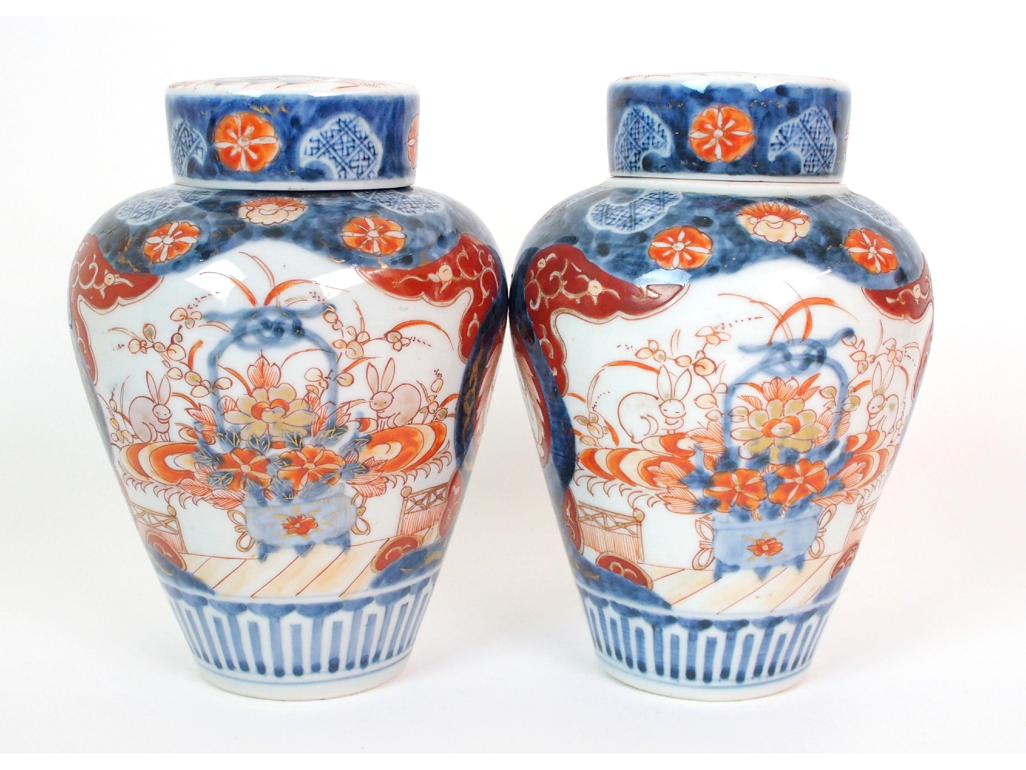 Appraisal: A pair of Imari baluster vases covers and liners painted