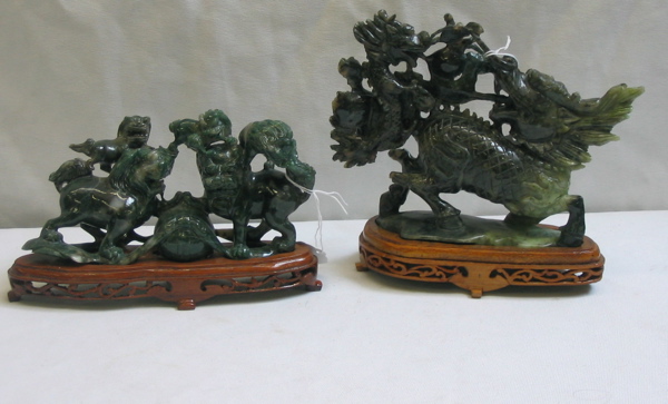 Appraisal: TWO CHINESE CARVED JADE FIGURAL DISPLAYS spinach colors fitted on