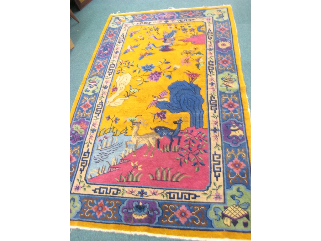 Appraisal: A bordered Chinese Rug the central field with deer birds