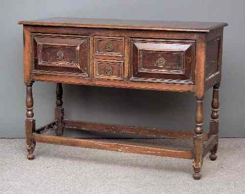 Appraisal: An oak dresser of '' th Century'' design fitted two