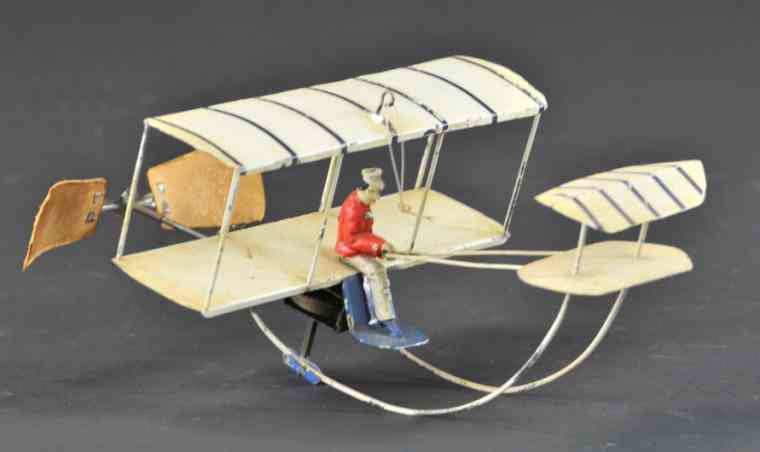 Appraisal: EARLY GERMAN BI-PLANE Hand painted overall features seated pilot bi-wing