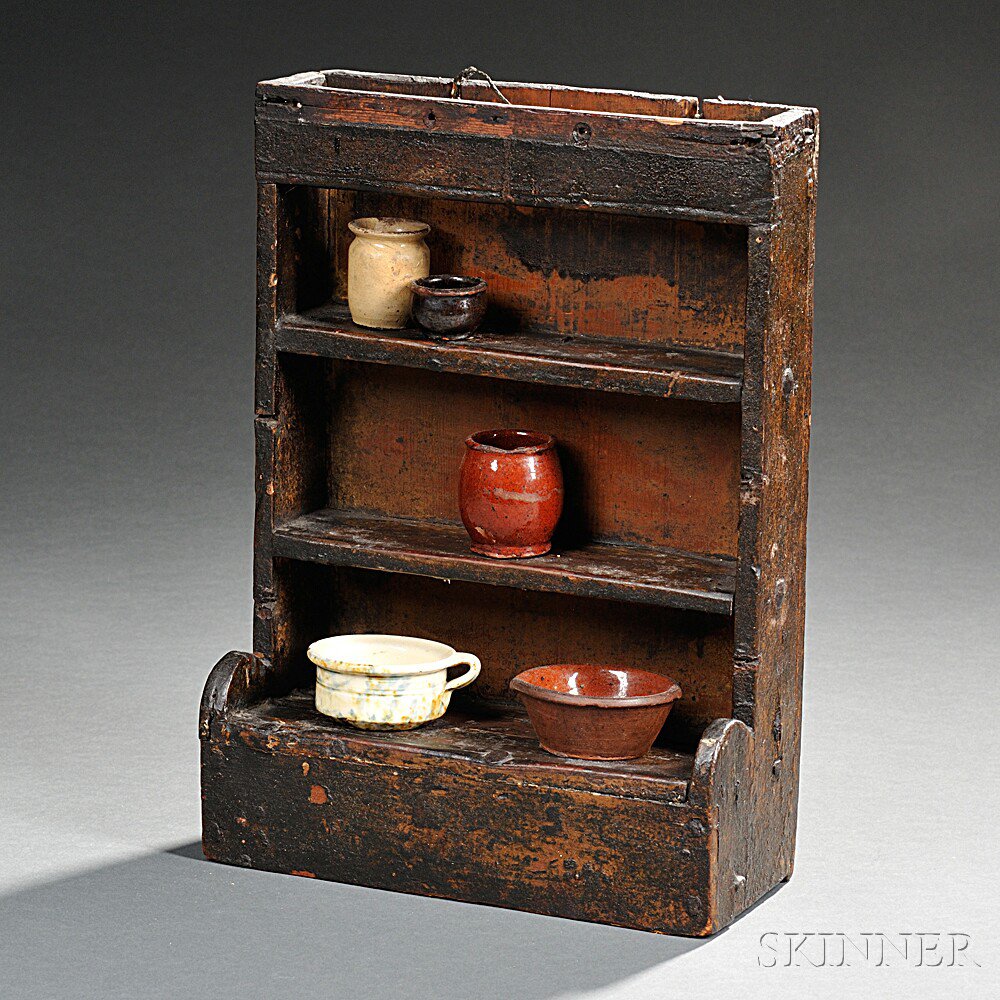 Appraisal: Miniature Hutch Cupboard with Five Pieces of Miniature Pottery America