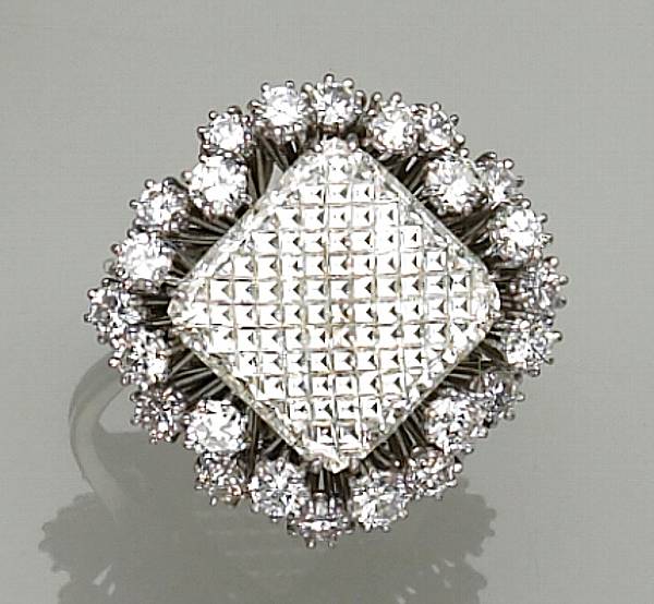 Appraisal: Property of Kitty Nagy centering a profile-cut diamond framed by