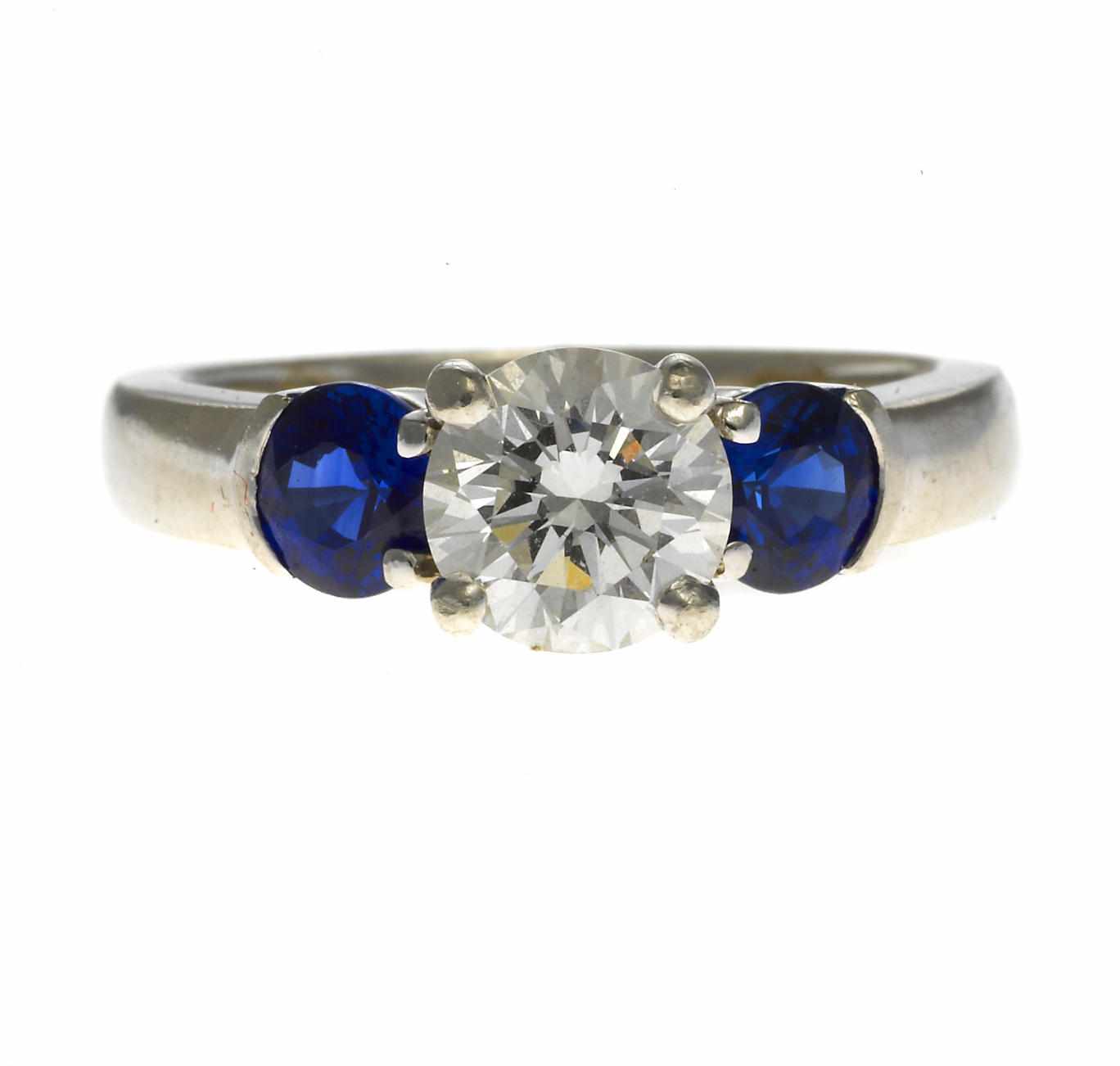 Appraisal: A diamond and sapphire ring with circular-cut sapphire shoulders estimated