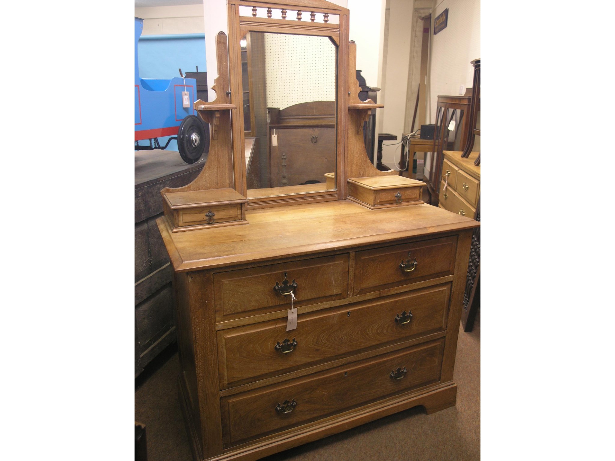 Appraisal: A late Victorian walnut dressing chest mirror and trinket drawers