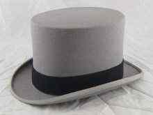 Appraisal: A gentleman's grey top hat size ths by Harrods