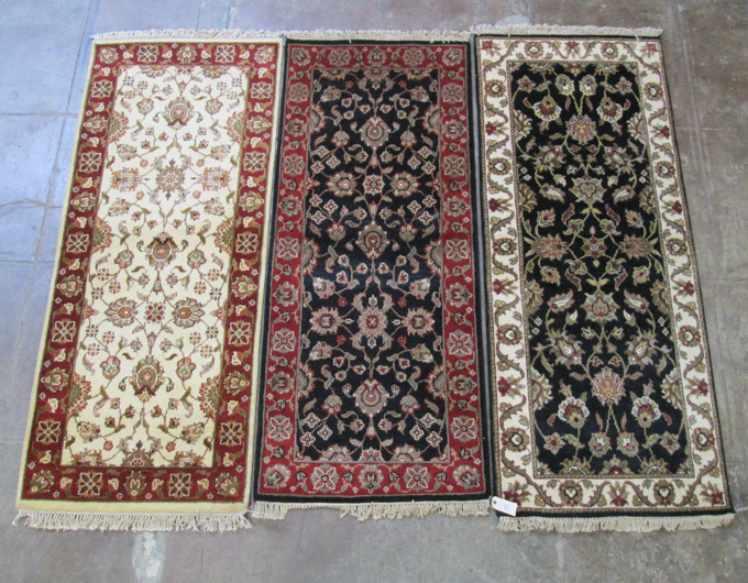 Appraisal: THREE HAND KNOTTED ORIENTAL AREA RUGS Indo-Persians all with overall