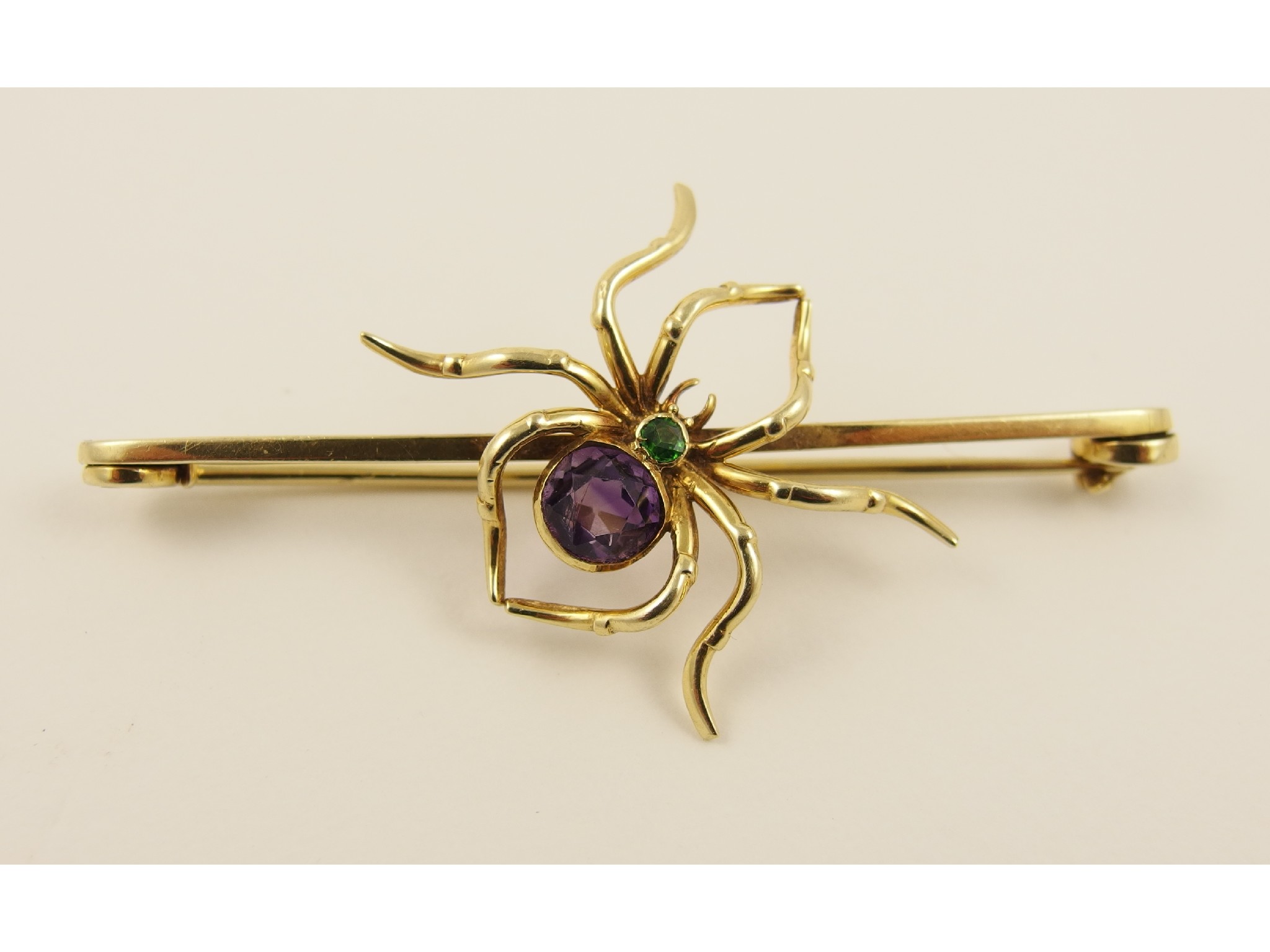 Appraisal: A ct Edwardian spider broochset with an amethyst and a