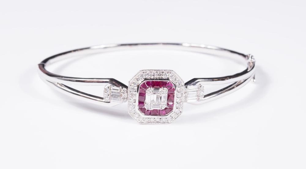 Appraisal: DIAMOND RUBY AND EIGHTEEN KARAT GOLD BANGLE The k white