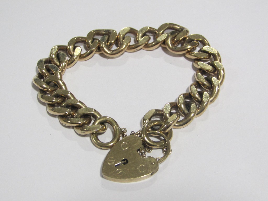 Appraisal: Nine carat gold flat curb link bracelet complete with padlock