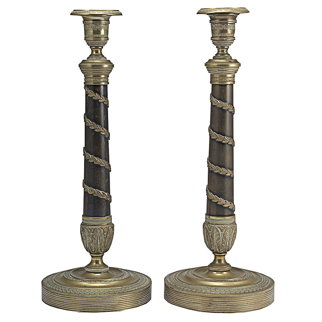 Appraisal: Pair of Austrian Neoclassical Style Gilt and Patinated-Metal Candlesticks Each