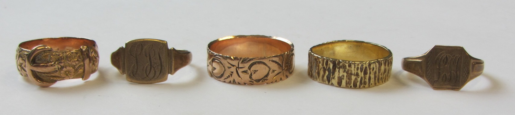 Appraisal: Five ct gold rings comprising two decorated wedding rings two