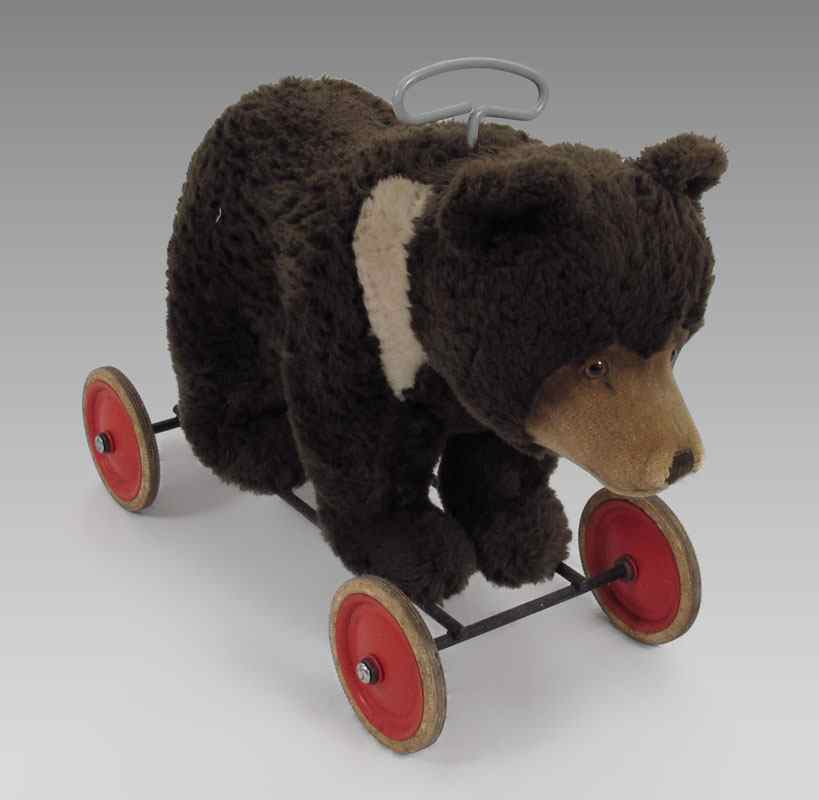 Appraisal: STEIFF RIDE ON BEAR CUB 's button brown fur with