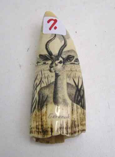 Appraisal: AN IVORY WHALE'S TOOTH scrimshawed and titled Gerenuk with a