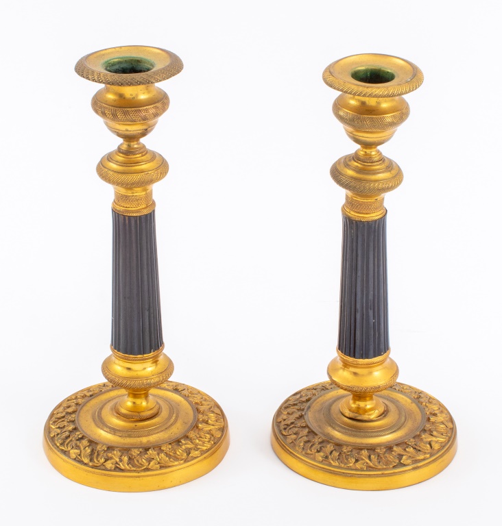 Appraisal: FRENCH RESTAURATION ORMOLU AND BRONZE CANDLESTICKS French Restauration ormolu and