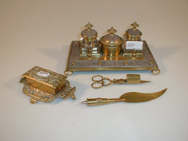 Appraisal: A brass rectangular desk stand with two ink receivers and