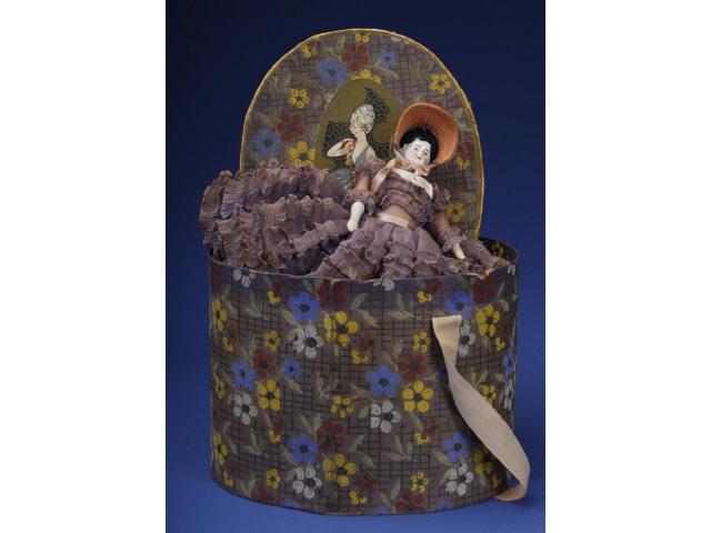 Appraisal: Hat Box with China Doll Germany ca glazed porcelain shoulder