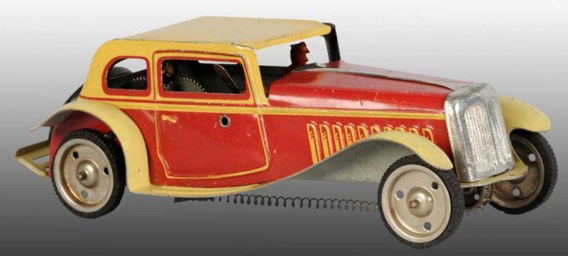 Appraisal: Tin Automobile Wind-Up Toy Description English Working Includes original driver