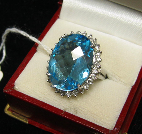 Appraisal: TOPAZ DIAMOND AND FOURTEEN KARAT WHITE GOLD RING WITH APPRAISAL