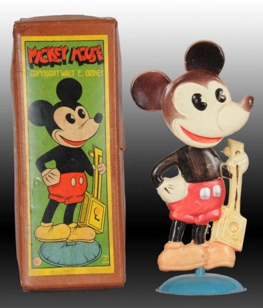 Appraisal: Walt Disney Celluloid Mickey Mouse Nodder Toy Description Includes scarce