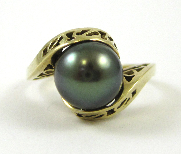 Appraisal: BLACK PEARL AND FOURTEEN KARAT GOLD RING set with a