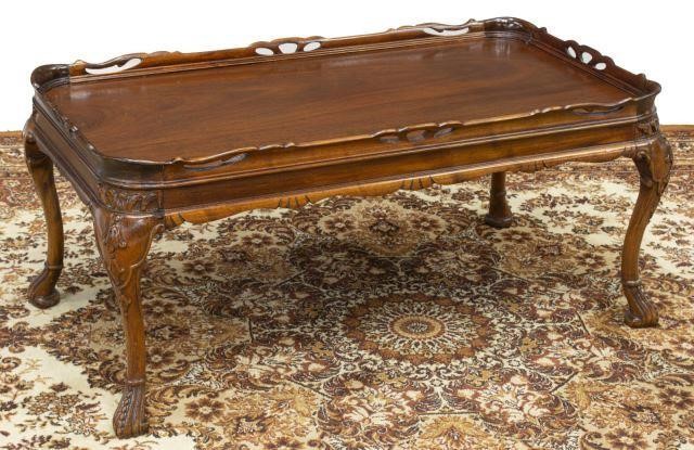 Appraisal: Carved mahogany coffee table th c having pierced gallery over