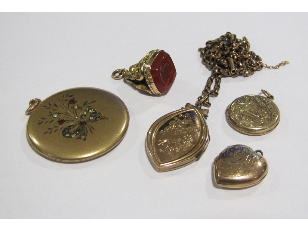 Appraisal: Lot comprising four rolled gold photo lockets and an intaglio