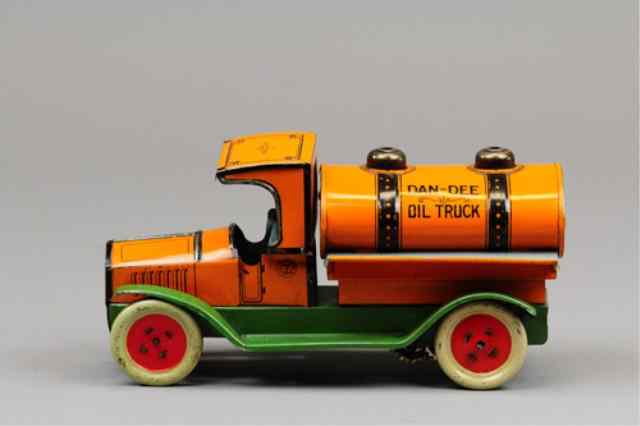 Appraisal: CHEIN DAN-DEE OIL TRUCKS C 's lithographed tin bright orange