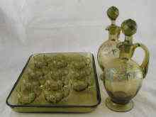 Appraisal: A green glass liqueur set comprising a tray eleven liqueur