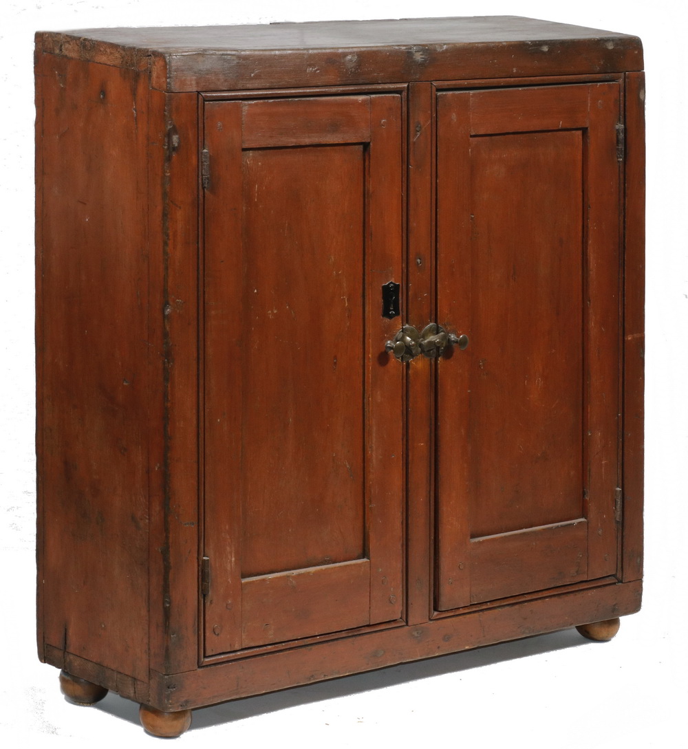 Appraisal: TWO DOOR COUNTERTOP CUPBOARD th c Small red painted pine