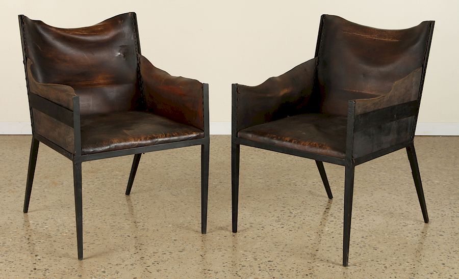 Appraisal: PAIR IRON LEATHER CHAIRS MANNER JEAN-MICHEL FRANK A pair of