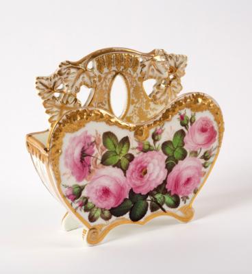 Appraisal: A porcelain heart-shaped wall pocket painted pink cabbage roses possibly