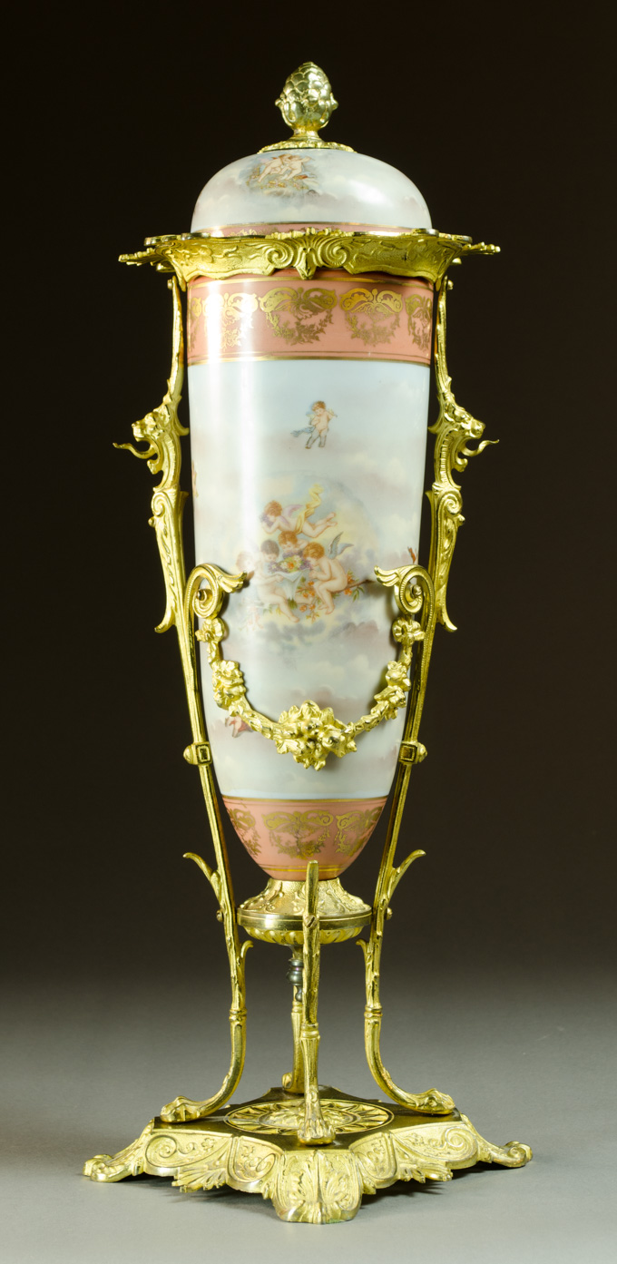 Appraisal: A FRENCH PORCELAIN COVERED URN the fitted original cover now