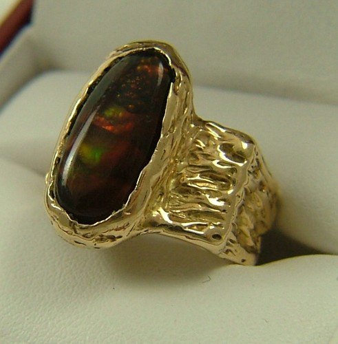 Appraisal: FIRE AGATE AND FOURTEEN KARAT GOLD RING set with a