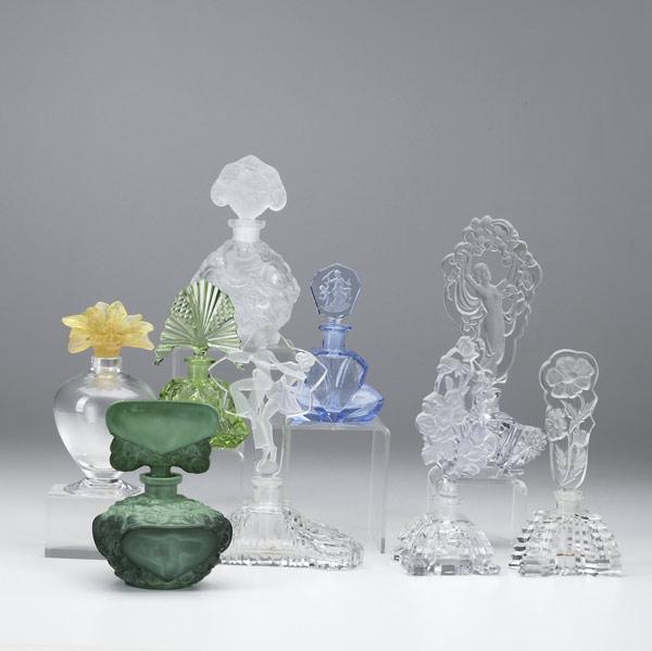 Appraisal: Nine figural glass perfume bottles th C Daum France clear