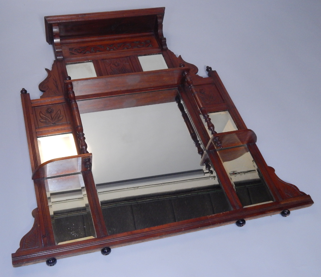 Appraisal: A Victorian mahogany overmantel mirror with an arrangement of shelves