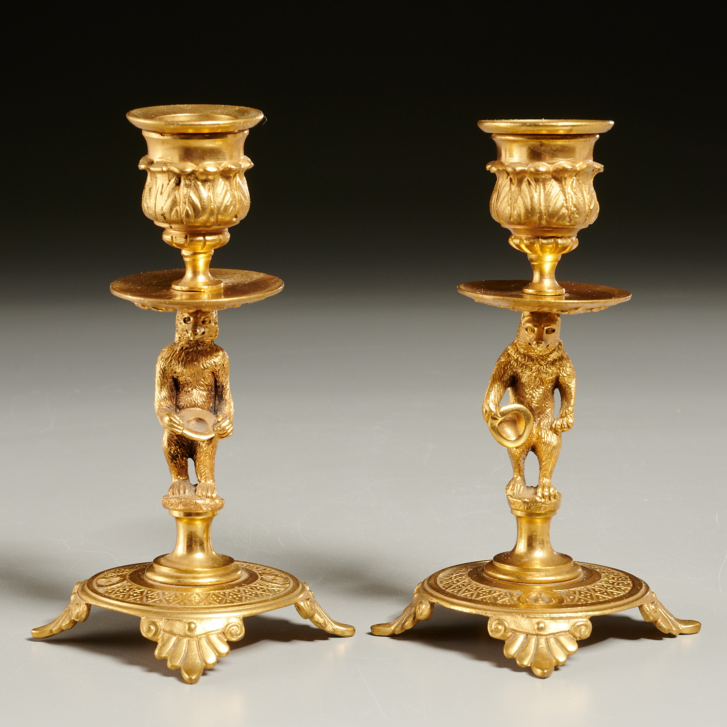 Appraisal: RUSSIAN ORMOLU PERFORMING BEAR CANDLESTICKS th th c gilt metal