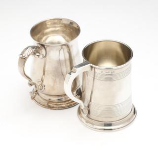 Appraisal: Two London sterling silver tankards The first George III dated